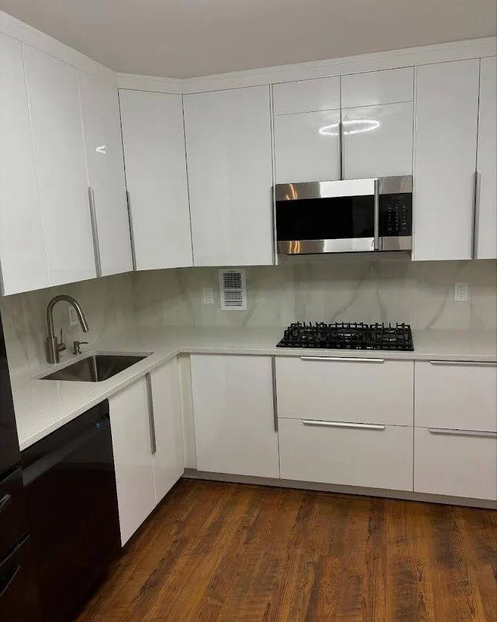 Restored kitchen with white cabinets after water damage in Clayton